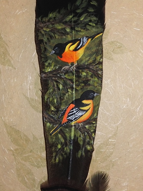 oriole painted on feather