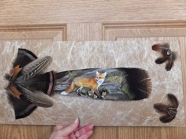 fox paiinted on a feather