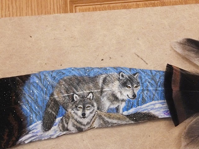 wolf painted on feather