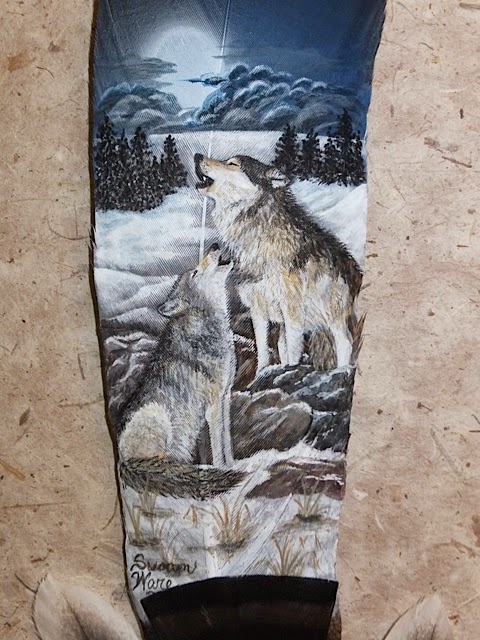 wolf painted on feather